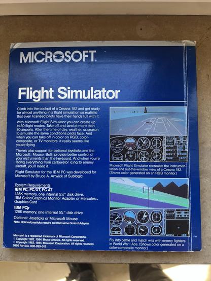 Image features the back cover of a Microsoft Flight Simulator software box. It includes a description of the flight simulation experience, system requirements for IBM PCs, and showcases graphics of the cockpit and landscape views. The design features a blue background with text and images of