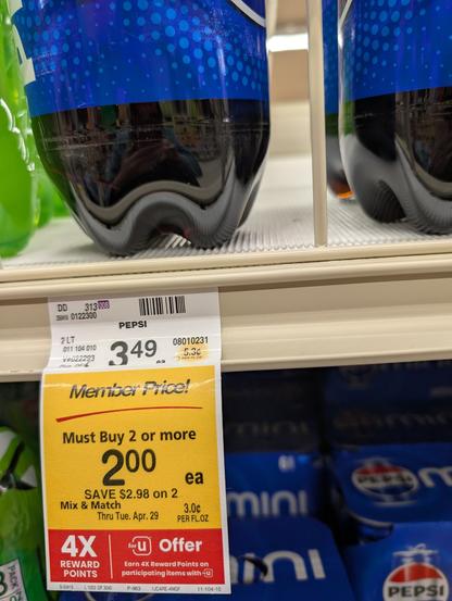 Shelf tag showing today's minimum price for an ounce of Pepsi: 3 cents per ounce (sale price with a loyalty card, minimum purchase of 2), or 5.3 cents per ounce if you don't have a card, or only want one bottle.