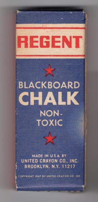 A box of chalk, printed in navy blue and red on white. At the top is the brand name, Regent, in red sans serif, all-capitals type. The brand name sits in a white box that spans the width of the box, with a red rule above and below. Under this white box is a red, 5-pointed star with the words "Blackboard Chalk" and "Non-Toxic" in all caps, reversed out of the navy blue field. Below that type is another red, 5-pointed star. At the bottom is the text, in sans-serif capitals, "Made in U.S.A. by United Crayon Co., Inc. Brooklyn, N.Y. 11217" and "Copyright 1947 by United Crayon Co., Inc."