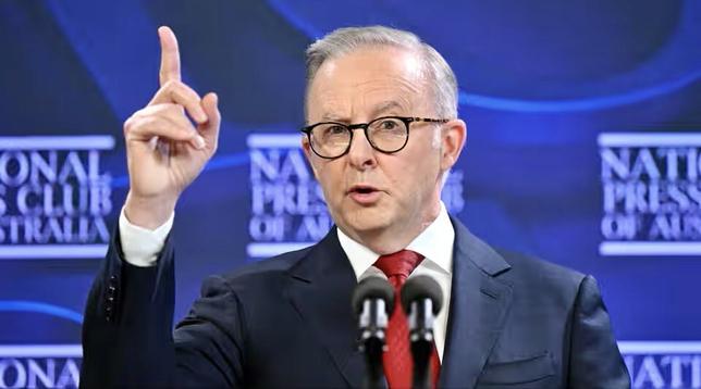 A man with a right hand pointing up, not afraid to talk to National media to all Australians.