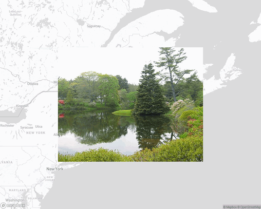 A photo of or from a park from the linked website, overlaid on a cropped world map where it's located.