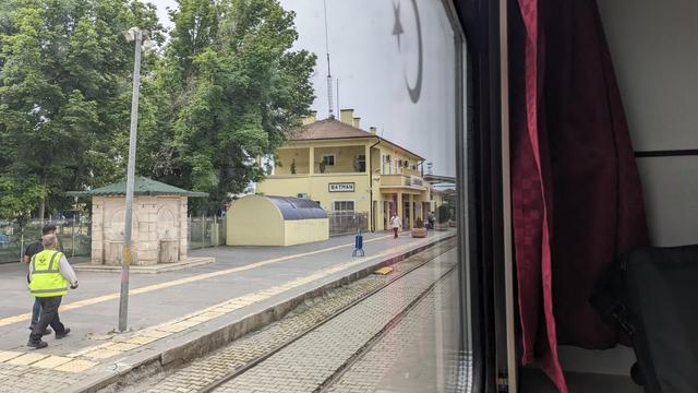 The Êlih station building photographed from inside the train.