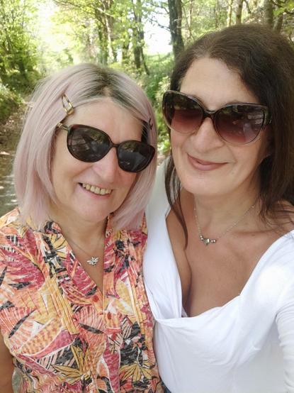 A selfie of two women walking in the country sidd