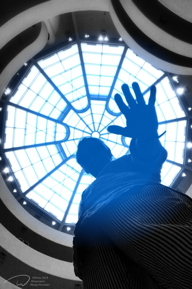 Selfportrait taken under the glass roof oof the Guggenheim Museum in NYC. Blue light coming in.