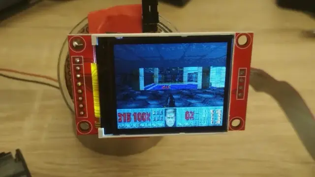 The chip from a $15 Ikea smart lamp sitting upright with Doom running on it. Photo credit: engineer who made it, Nicola Wrachien