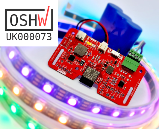 Red circuit board with a blue battery in the background. In the foreground is a string of multicoloured leds
In the top left corner is the OSHWA registration number UK00073