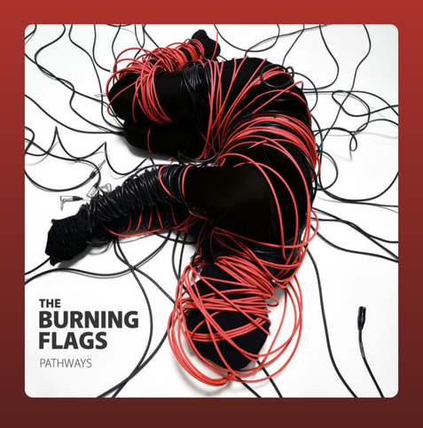 The album cover for Pathways by The Burning Flags features a striking visual of a human figure entirely wrapped in black and red electrical cables, lying curled up on a white background. The cables are tangled and chaotic, symbolizing entrapment or complexity, while the person is dressed in black, further emphasizing the dramatic contrast. The band's name, The Burning Flags, and the album title, Pathways, are displayed in bold black text in the lower-left corner. The overall aesthetic is intense and thought-provoking, reflecting themes of struggle, constraint, and possibly liberation.