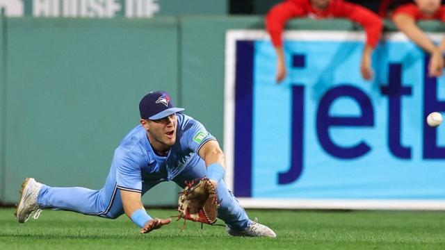 Blue Jays' Daulton Varsho returns with spectacular tumbling catch