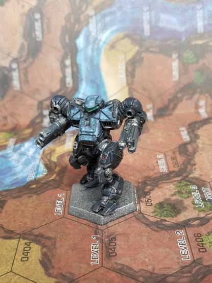 Front view of a Nova Cat from Battletech, in Clan Nova Cat Alpha Galaxy colors. Angled so both the Nova Cat and Alpha Galaxy insignias are visible