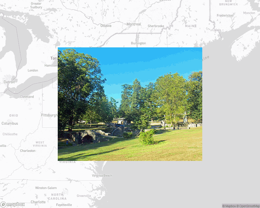 A photo of or from a park from the linked website, overlaid on a cropped world map where it's located.