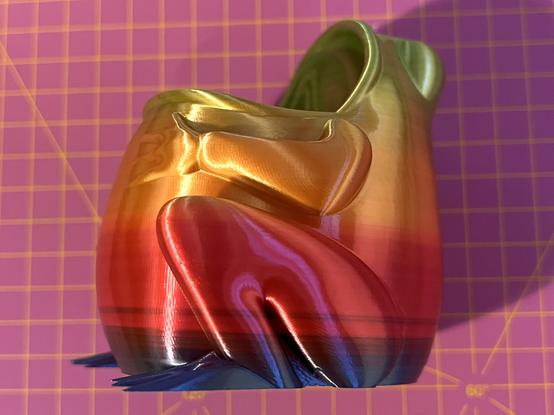 A 3D printed object printed with Eryone Silk Rainbow PLA filament.

The colour gradient of the print is not smooth and has visible banding / striping of colours as the hue changes.