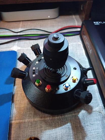 A black, "MIDI Rock: Stone" joystick controller