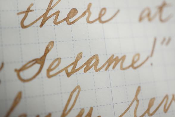 "Sesame!" written with light brown ink