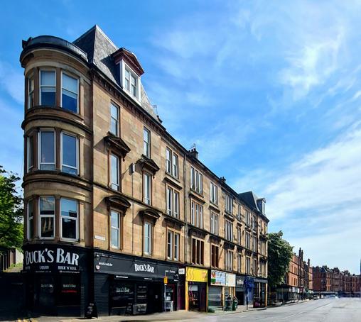 Victorian tenements lining a Glasgow street.