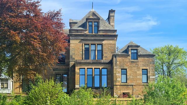 A blonde sandstone Victorian villa in Glasgow.