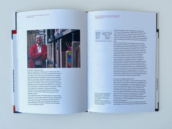 Spread with a picture of Peter Verheul (Farhill) posing in the library of the royal academy.