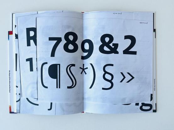 Spread with marked printouts of the Sans version.