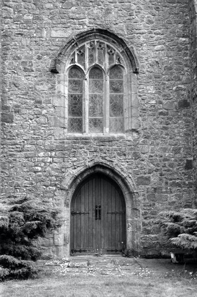 Door and window on the bell tower of St Wilfrid's church, Ribchester, UK.