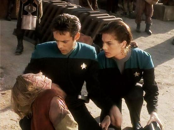 Bashir combats pessimism and fear while trying to cure a fatal genetic disease the Jem'Hadar inflicted on a Gamma Quadrant planet 200 years ago.