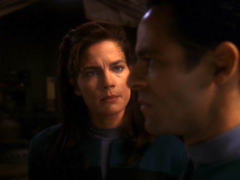 Bashir combats pessimism and fear while trying to cure a fatal genetic disease the Jem'Hadar inflicted on a Gamma Quadrant planet 200 years ago.