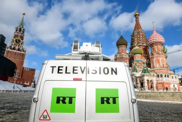 Russia's state-controlled Russia Today (RT) television broadcast van is parked in front of St. Basil's Cathedral and the Kremlin next to Red Square in Moscow, Russia