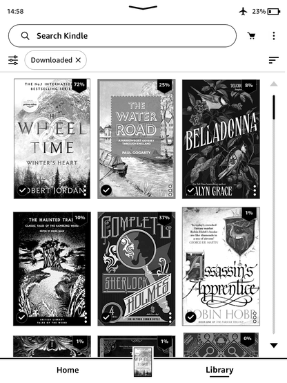 Screenshot of a Kindle Paperwhite, black & white screen, showing 6 book covers. On the top row are Wheel of Time Winter's Heart by Robert Jordan, The Water Road narrowboat book by Paul Gogarty and Belladonna by Adalyn Grace. Below are The Haunted Trail collection of weird fiction in the British Library Tales of the Weird series, a collected Complete Sherlock Holmes, and Assassin's Apprentice by Robin Hobb. Progress percentages for the books include 72% through the Wheel of Time book, 25% through the canals book, 8% through Belladonna (only recently started), and 37% through Sherlock Holmes (nearing the end of "Memoirs").