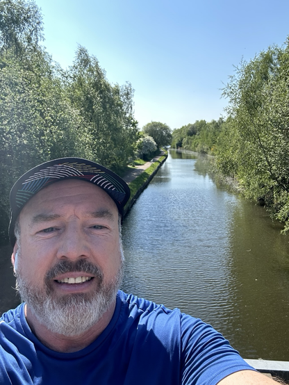 Happy man above canal
