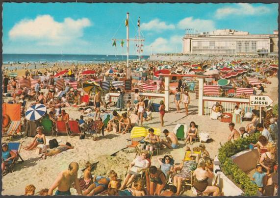 Printed colour postcard showing an animated view of the beach and Kursaal at Ostend in West Flanders, Belgium.

Published by Kruger, No 933/48, c.1960s.

Postally unused.

Very good condition, with minimal corner bumps, but slight rubbing to the back.