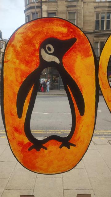 The famous orange oval with the Penguin in the middle, the logo for Penguin Books