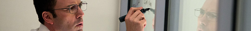 Ben Affleck as The Accountant, writing on a window like all geniuses do.