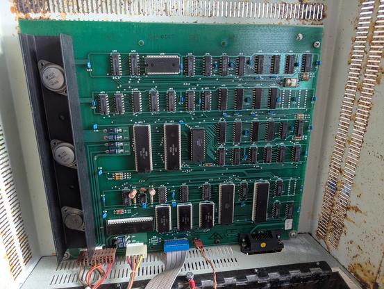 Commodore 4040 disk drive with two 5 and a quarter inch floppy disk drives.  The motherboard PCB is screwed to the underside of the lid so they always look clean and tidy and this one is no exception.