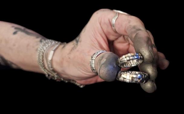 Working hand holding two rings