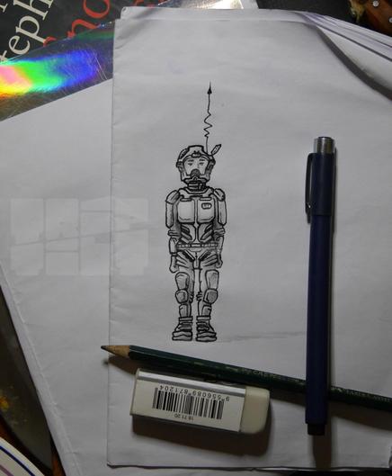 photograph of a lineart sketch/drawing of a person in a scifi spacesuit...