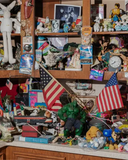 The shelves in Daniel Johnston’s kitchen are completely filled with figurines and keepsakes. The house remains largely as he left it before his 2019 death.