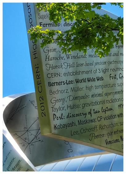 Sculpture of metal, with Names and achievements written on it. You can see "Berners-Lee: World Wide Web."
