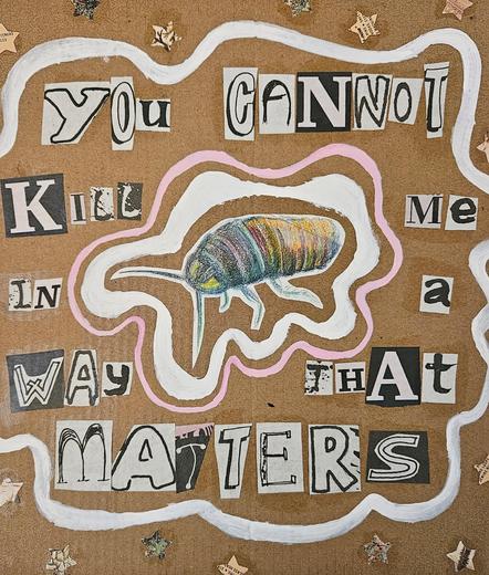 A colored pencil drawing of a cockroach in rainbow colors, cut and pasted to a cardboard background. Wavy pink and white lines surround the roach, along with newspaper clippings that spell out "You cannot kill me in a way that matters." The top and bottom edges include star-shaped cutouts in tan and green.