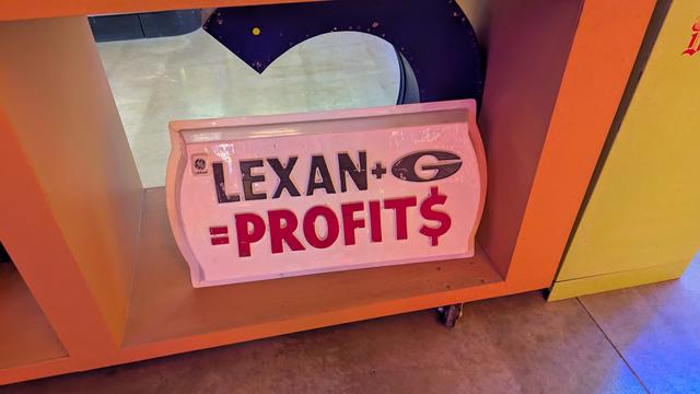 An old plastic sign that says "LEXAN + G =PROFIT$". I don't actually know what the G means in this context, I just thought the sign was interesting.