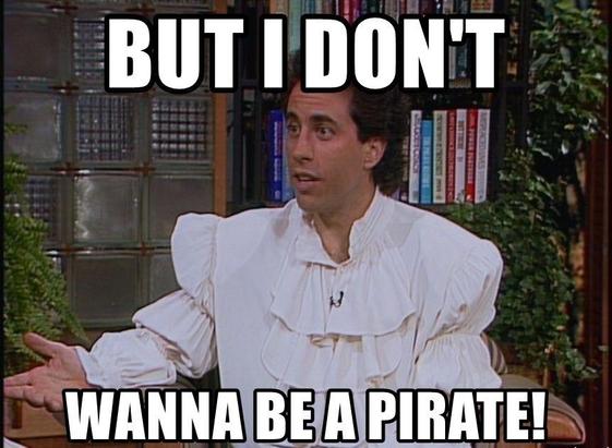 Jerry Seinfeld wearing a white ruffled pirate shirt, saying but I don't wanna be a pirate!