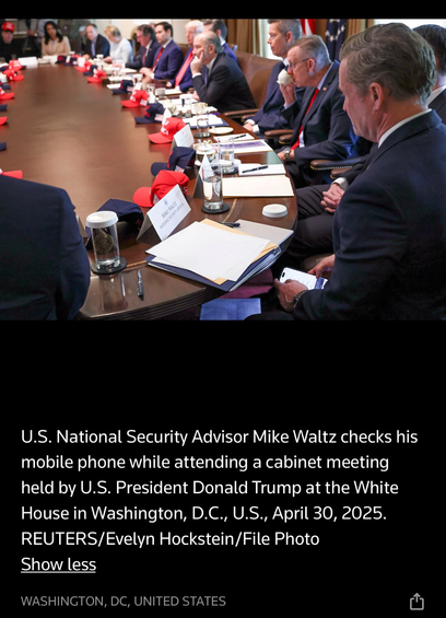 U.S. National Security Advisor Mike Waltz checks his mobile phone while attending a cabinet meeting held by U.S. President Donald Trump at the White House in Washington, D.C., U.S., April 30, 2025. REUTERS/Evelyn Hockstein/File Photo