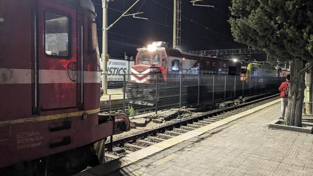 A TCDD diesel locomotive hauling my night train on the opposite track.