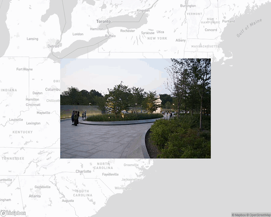 A photo of or from a park from the linked website, overlaid on a cropped world map where it's located.