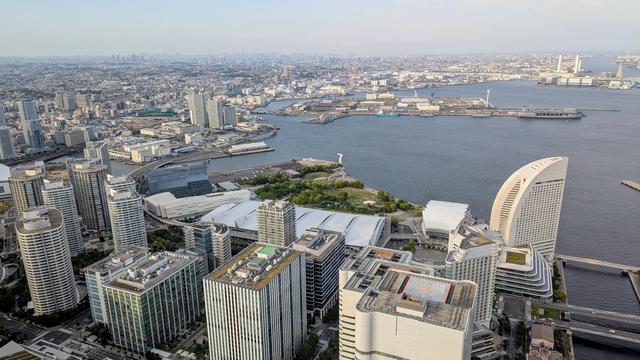 Cityscape of Yokohama with highrise buildings and the sea. Pacifico conference venue seen from the Landmark Tower.