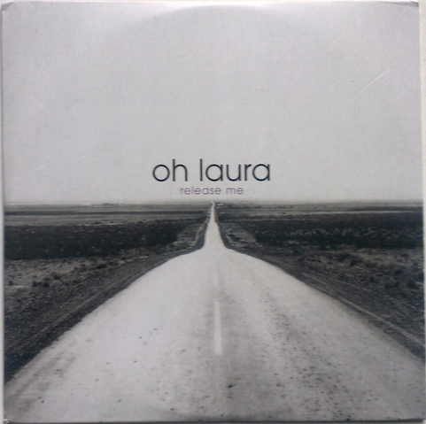 The cover for the single "Release Me" by Oh Laura which is a black and white photo of road disapprearing into a dry, arid plain and eventually the horizon.