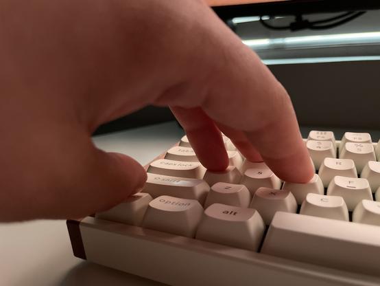 Hand with three fingers on WAS keys. My thumb is flexed inward to press the control key with my fingernail in order to crouch.