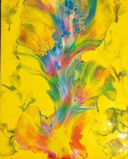 A brightly colored fluid art piece: the background is yellow with wisps of green and brown (the latter symbolizing new plant growth), and the center is a vertical blowout in shades of red, pink, blue, green, and white.