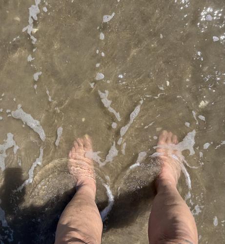 Selfie of my feet freezing in the water at the beach.