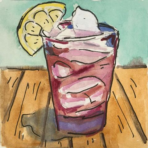 A pink drink with ice and a lemon slice on the side of the glass.