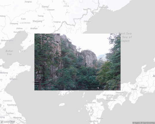 A photo of or from a national park from the linked website, overlaid on a cropped world map where it's located.