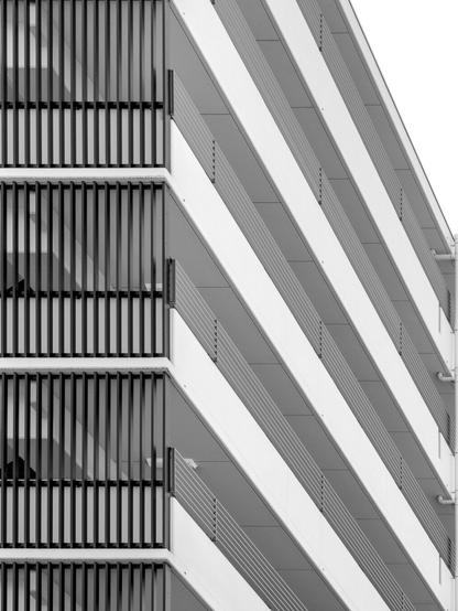 High contrast monochrome shot of apartment block; a little abstract.