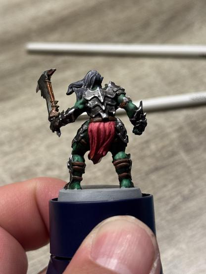 The orc warrior of heroquest. It is shown from the back after a little more highlights were added to it. It is a work in progress.